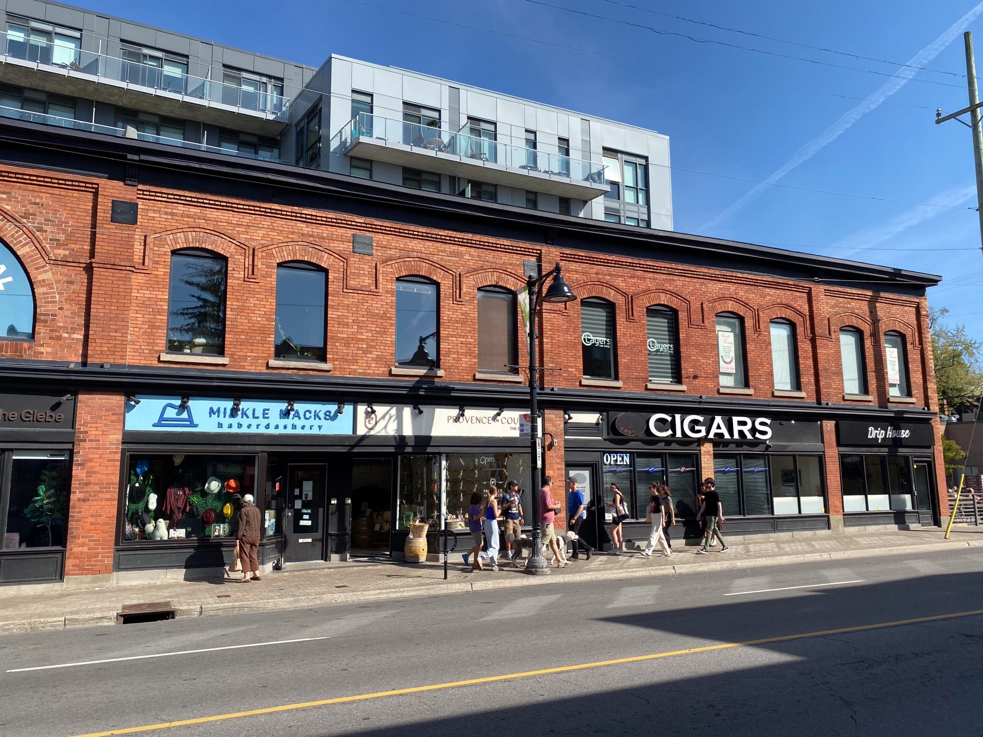 A recent apartment redevelopment at the corner of Bank Street and Fifth Avenue preserved a block of heritage storefronts. Photo by Laura Byrne Paquet.